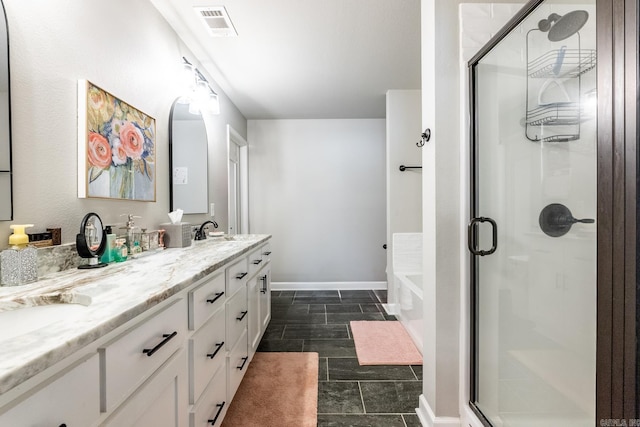 bathroom featuring vanity and shower with separate bathtub