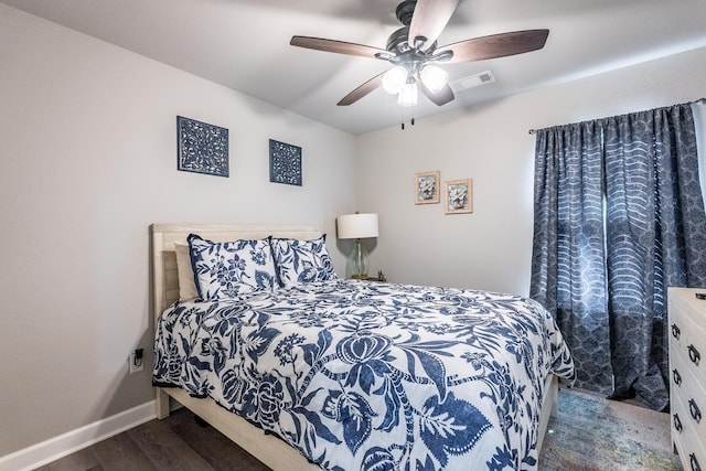 bedroom featuring ceiling fan and dark hardwood / wood-style flooring