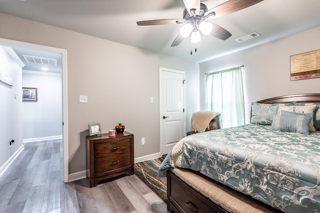 bedroom featuring light hardwood / wood-style floors and ceiling fan