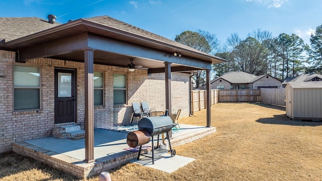 exterior space with ceiling fan and a shed