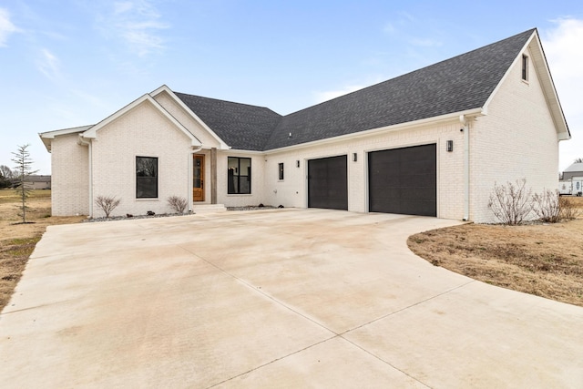 modern farmhouse style home with a garage