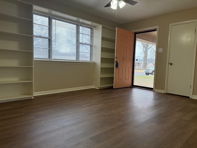 empty room featuring hardwood / wood-style floors and ceiling fan