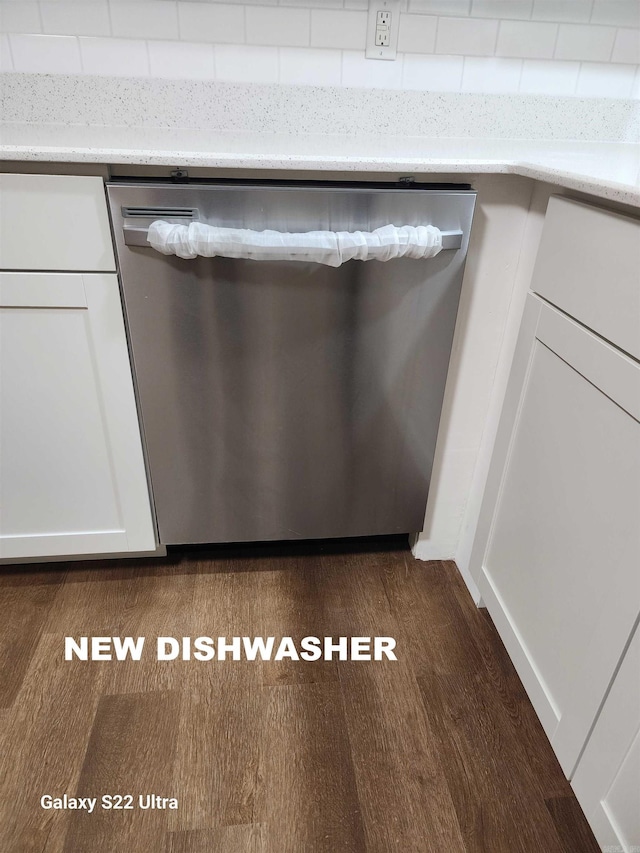 interior details featuring hardwood / wood-style flooring and dishwasher