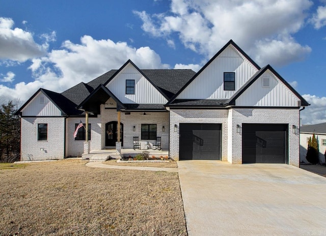 modern farmhouse with a front lawn and a porch