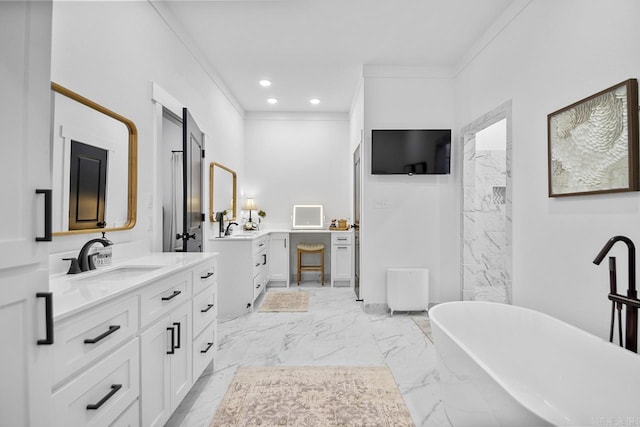 bathroom with a washtub, vanity, and crown molding