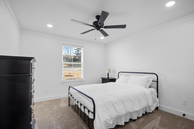 bedroom featuring crown molding, ceiling fan, and carpet