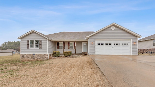 ranch-style house featuring a garage and a front lawn