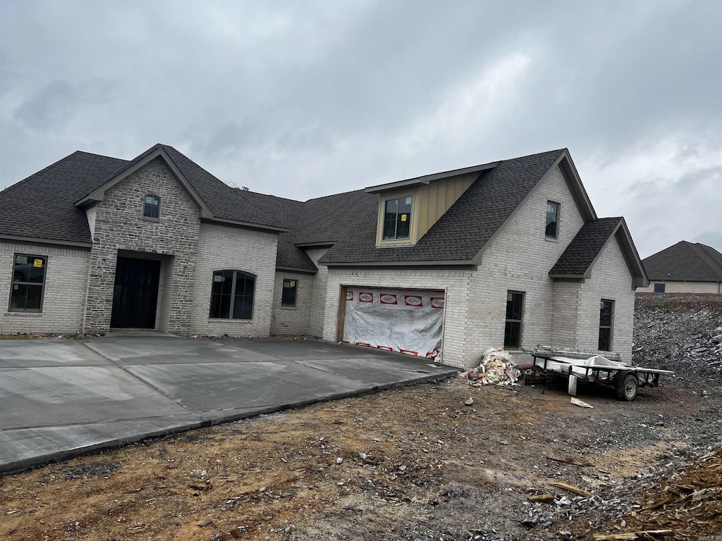 french provincial home featuring a garage