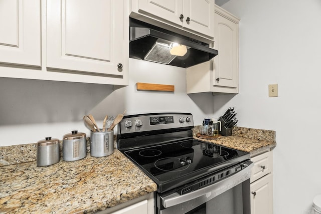 kitchen featuring white cabinetry, light stone countertops, and stainless steel range with electric cooktop