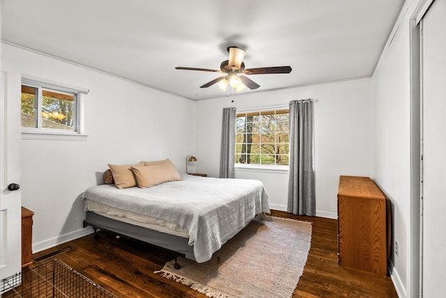 bedroom featuring dark hardwood / wood-style flooring and ceiling fan