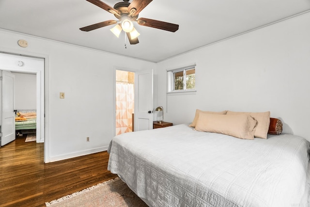 bedroom featuring ceiling fan, connected bathroom, and dark hardwood / wood-style flooring