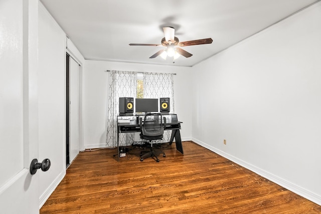 home office with wood-type flooring and ceiling fan