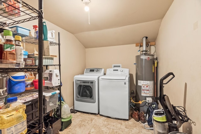 clothes washing area featuring separate washer and dryer and water heater