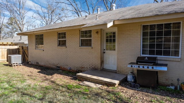 rear view of property with central air condition unit