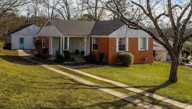 ranch-style home featuring a porch and a front yard