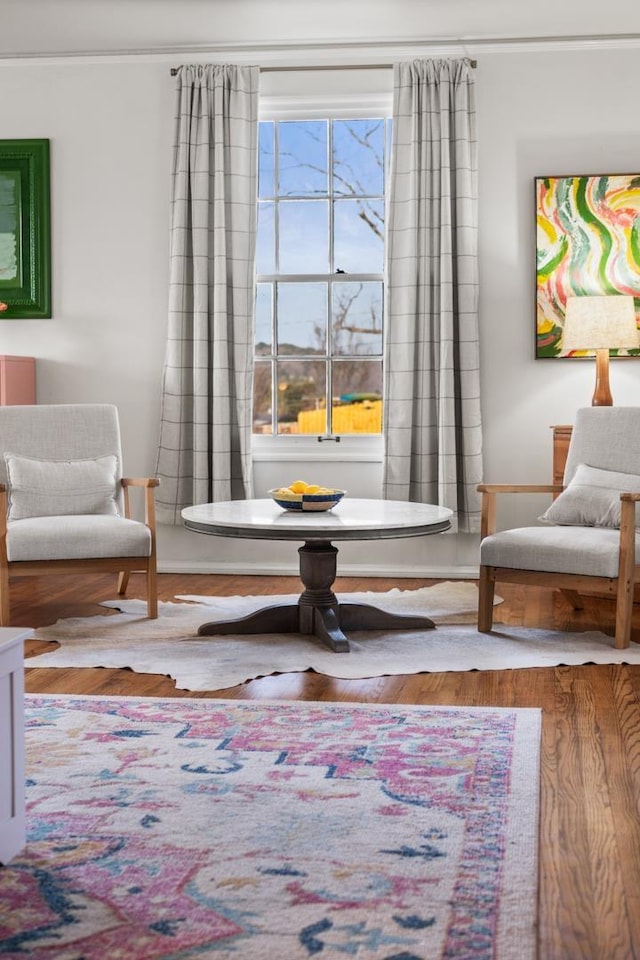 living area with hardwood / wood-style floors