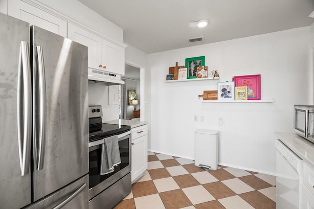 kitchen with appliances with stainless steel finishes and white cabinets