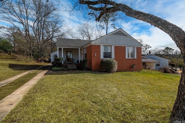 view of front of property with a porch and a front lawn