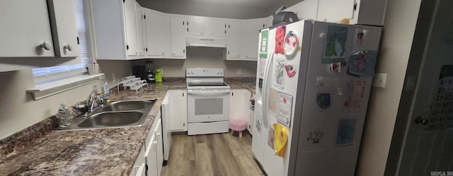 kitchen featuring sink, white appliances, light hardwood / wood-style floors, and white cabinets