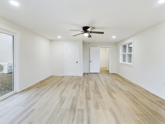 unfurnished room featuring ceiling fan and light hardwood / wood-style floors