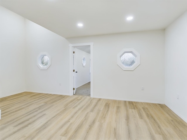 unfurnished room with light hardwood / wood-style floors