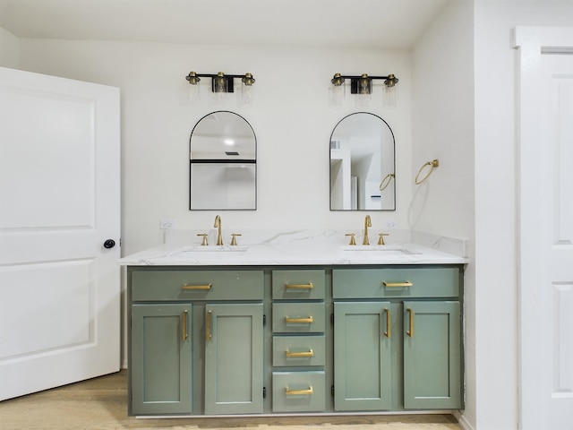 bathroom with vanity and wood-type flooring