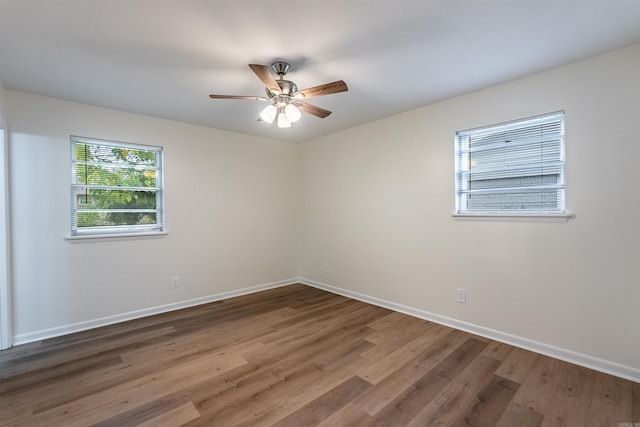 empty room featuring wood-type flooring and ceiling fan