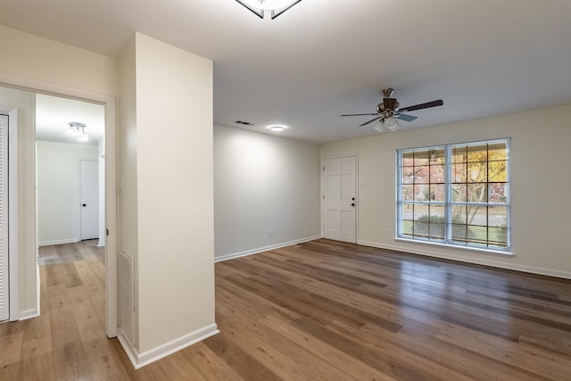 interior space featuring wood-type flooring and ceiling fan