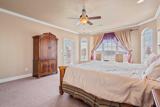 bedroom with ceiling fan, ornamental molding, light carpet, and a textured ceiling