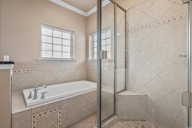 bathroom with crown molding and independent shower and bath