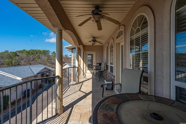 view of patio / terrace featuring a balcony and ceiling fan