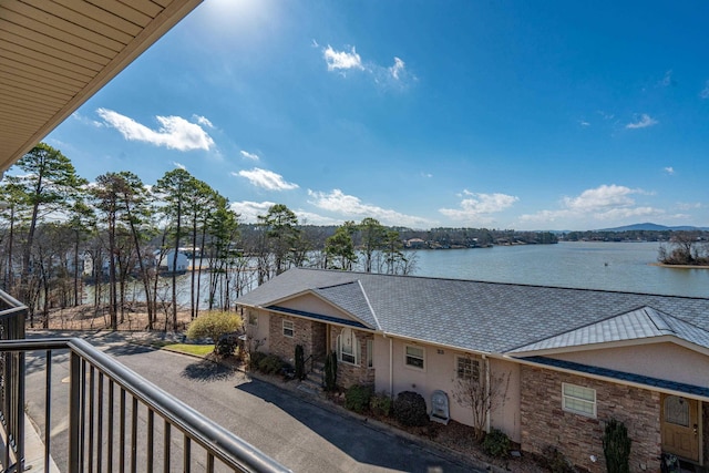 balcony featuring a water view