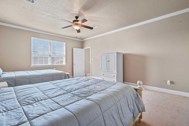 carpeted bedroom featuring ceiling fan, ornamental molding, and a textured ceiling