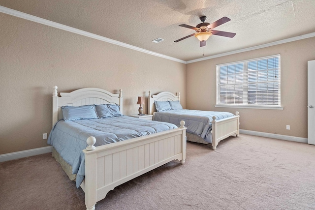 bedroom featuring crown molding, carpet flooring, and a textured ceiling