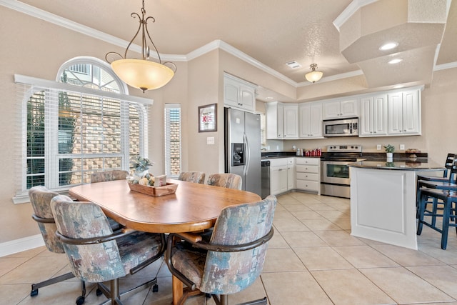 dining room featuring crown molding, a textured ceiling, and light tile patterned floors