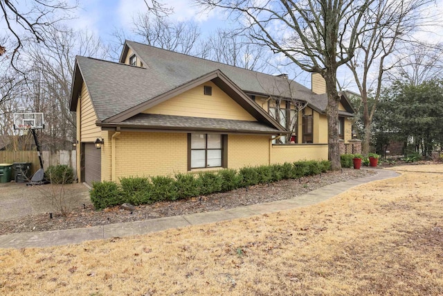 view of property exterior with a garage