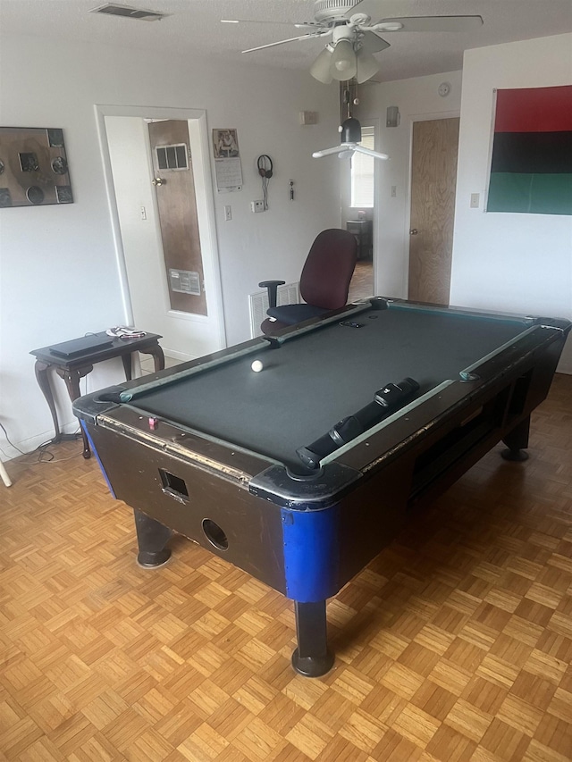 game room with ceiling fan, pool table, and light parquet floors