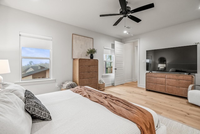 bedroom featuring hardwood / wood-style flooring and ceiling fan