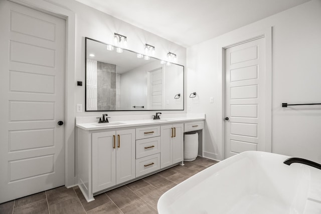 bathroom with vanity and a bathtub