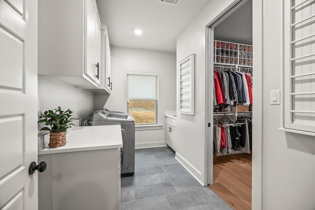 laundry area with cabinets and washer and dryer