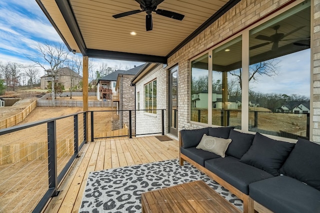 deck with ceiling fan and outdoor lounge area