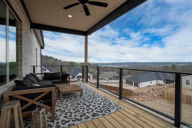 balcony featuring ceiling fan and an outdoor living space