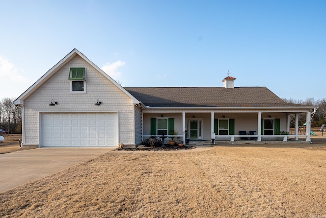 view of front of property featuring a garage and covered porch