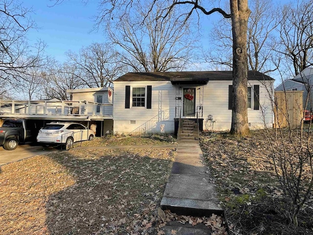 view of front of home featuring crawl space and driveway