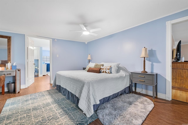 bedroom with wood-type flooring, ornamental molding, and ceiling fan