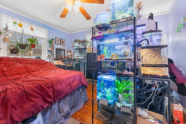 bedroom featuring wood-type flooring and ornamental molding