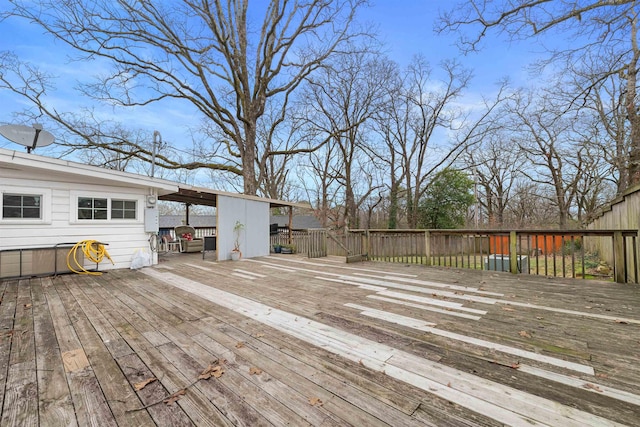 deck featuring an attached carport