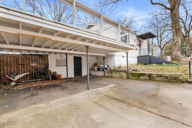 exterior space featuring a carport and driveway