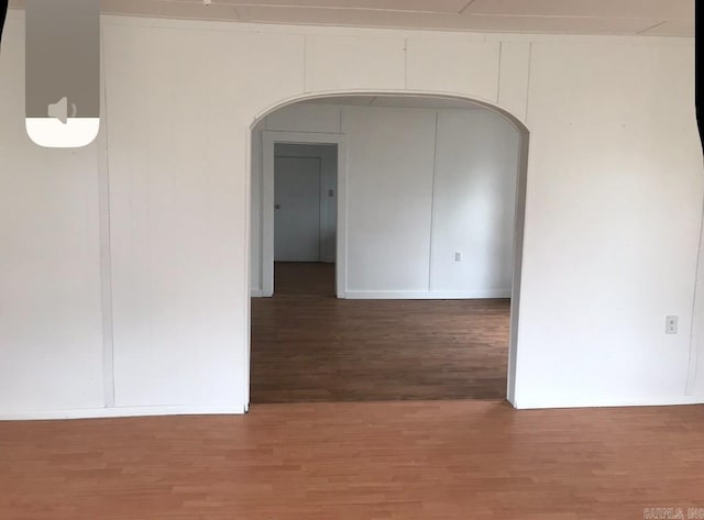 empty room featuring dark hardwood / wood-style flooring