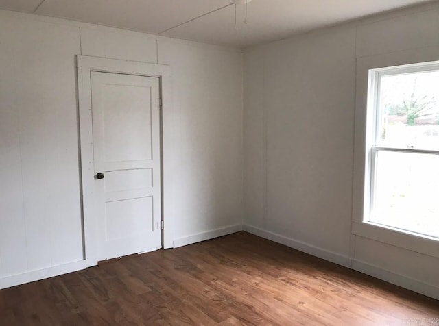 unfurnished room featuring wood-type flooring